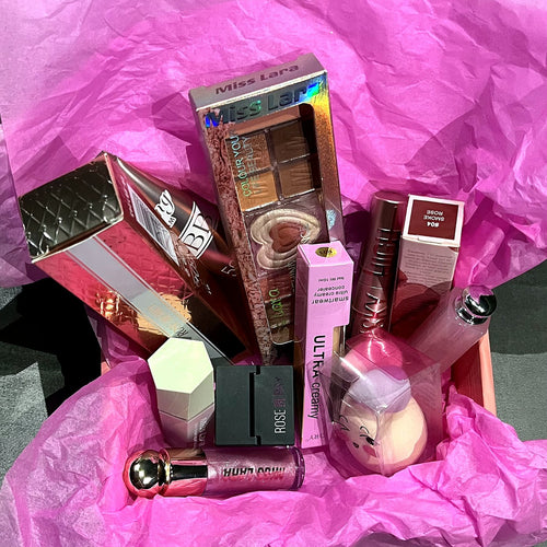 Nayle Beauty Box opened, with nine makeup products in pink tissue